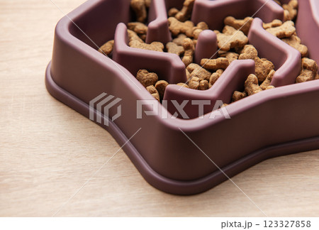 Slow feeder dog bowl reducing bloating and improving digestion 123327858