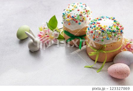 Easter cakes with colorful sprinkles, decorated eggs, and festive ornaments celebrating spring holiday 123327869