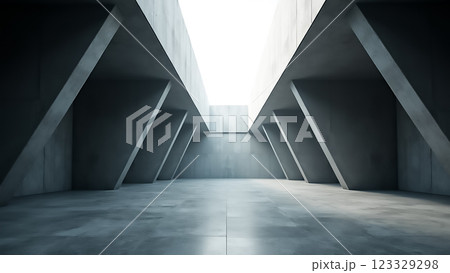 Minimalist architectural space with stark angles and light filtering through an opening 123329298