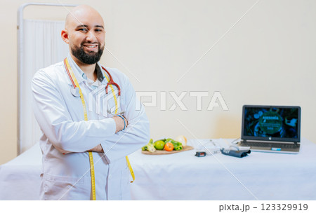 Portrait of smiling male nutritionist at his workplace. Smiling nutritionist doctor with crossed arms in her office. Portrait of smiling professional nutritionist. Portrait of smiling male nutritionist at his workplace. Smiling nutritionist doctor with crossed arms in her office. Portrait of smiling professional nutritionist. 123329919