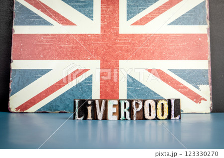 LIVERPOOL. Urban Area in Great Britain. Flag and alphabet letters on wooden texture background LIVERPOOL. Urban Area in Great Britain. Flag and alphabet letters on wooden texture background 123330270
