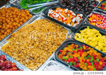 assortment of dried fruits, sweets, candies and marmalade on Asian market in Asia 123330448