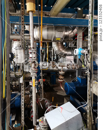 Steel structure is under construction on the construction site against a blue sky backdrop 123332408