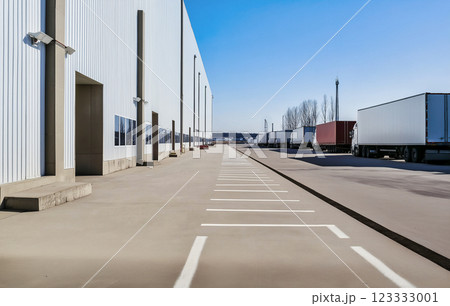 concrete parking lot and warehouse with trucks concrete parking lot and warehouse with trucks 123333001