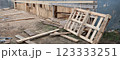 Wood house demolition or disaster with wooden boards 123333251