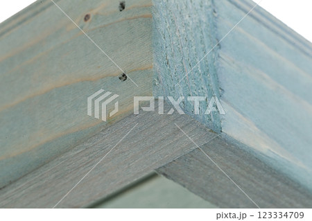 Fragment of a wooden box on a white background close-up 123334709
