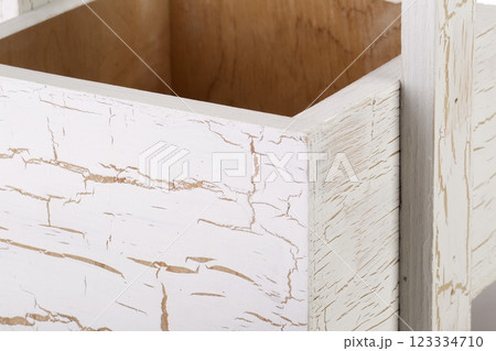 Fragment of a wooden box on a white background close-up 123334710