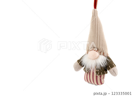 on white background hanging textile soft Christmas tree toy in the form of a forest gnome with a large cap pastel colors modern decor on white background hanging textile soft Christmas tree toy in the form of a forest gnome with a large cap pastel colors modern decor 123335001