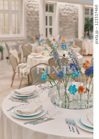 Served festive table with colorful flowers 123337460