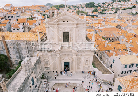 People leave the Church of St. Ignatius into the courtyard. Dubrovnik, Croatia. Top view 123337592