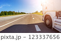 Closeup panoramic view of the white truck driving on the asphalt road. 123337656