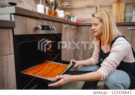 Baking delicious treats in a cozy modern kitchen during the afternoon Baking delicious treats in a cozy modern kitchen during the afternoon 123338641