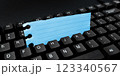Colored sticker lying on black keyboard. Important information written over paper. Image with school supplies. Multiple Assorted Collection Office Stationery. 123340567