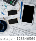 Phone With Important Message On Desk With Wood Tables And Clipboard. Cellphone Screen With Crutial Announcement. Calculator, keyboard, cup of coffee and pens. 123340569