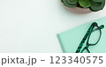 Office Supplies Over Desk With Keyboard And Glasses And Coffee Cup For Working Remotely, 123340575