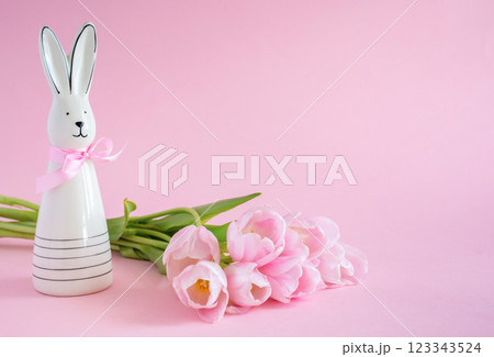 Easter Card with Bunny and Tulips on Pink Background with Copy Space 123343524