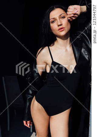 Beautiful slim fashion brunette woman in leather jacket 123344707