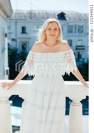 woman in summer dress smiling woman in summer dress smiling 123344811