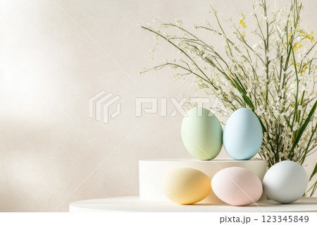 Pastel easter eggs with delicate flowers on minimalist background 123345849