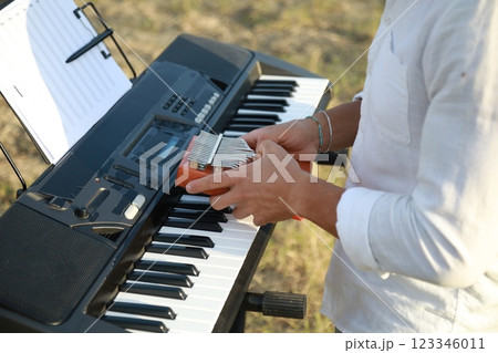 Piano Tuning Tool Used By Man Close Up Piano Tuning Tool Used By Man Close Up 123346011