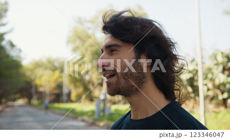 Man In Love With Long Hair Smiles At A Girl He Met On The Street Man In Love With Long Hair Smiles At A Girl He Met On The Street 123346047
