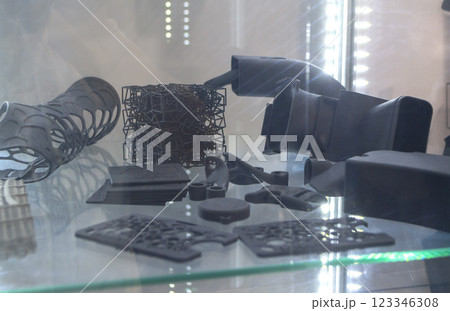 Complex multi-part models printed on 3D printer from black polyamide powder. Detailed prototype created on 3D printer from plastic powder. 3D printing powder technology Multi Jet Fusion MJF technology 123346308