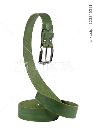 The green leather belt with a metal buckle is beautifully curved and isolated on a white background. 123346511
