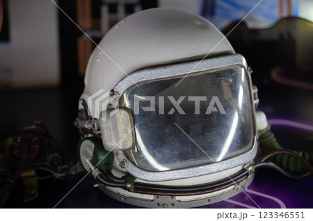 A helmet for an astronaut in close-up on a dark background. A helmet for an astronaut in close-up on a dark background. 123346551