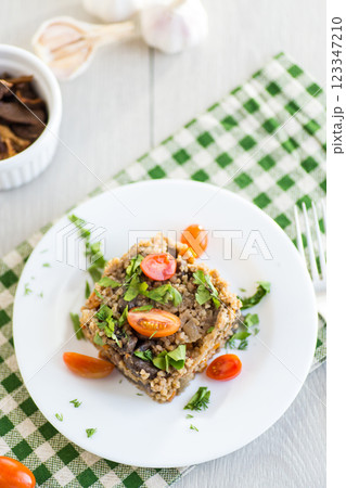 cooked bulgur with mushrooms and vegetables 123347210