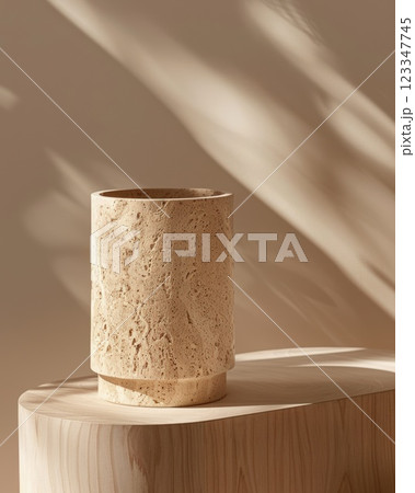 Stone Vase on Wooden Surface with Soft Light and Shadows 123347745