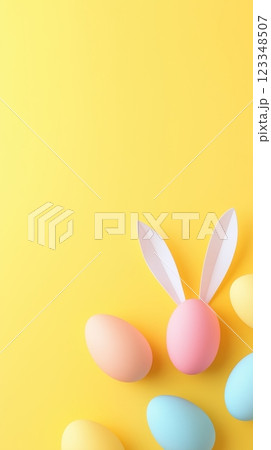 Colorful Easter eggs and bunny ears create a festive atmosphere on a pastel yellow background Colorful Easter eggs and bunny ears create a festive atmosphere on a pastel yellow background 123348507