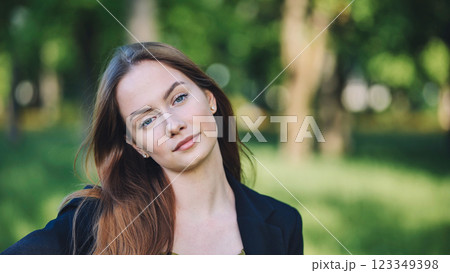 Portrait of a confident businesswoman posing in a park, enjoying the fresh air and greenery Portrait of a confident businesswoman posing in a park, enjoying the fresh air and greenery 123349398