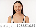 Smiling Individual Portrait with Positive Expression in a Neutral Setting 123351085