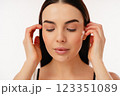 Portrait of a Peaceful Woman With Eyes Closed and Relaxed Expression 123351089