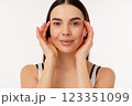 Portrait of a Smiling Woman Holding Her Face With Both Hands 123351099
