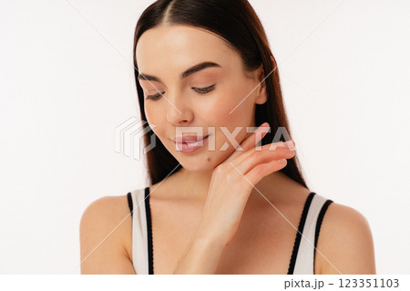 Young Person With Smooth Skin Showing a Natural Glow in Casual Attire 123351103