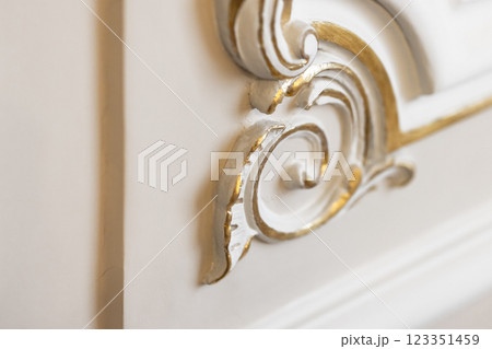 Close up view of an intricate golden decoration Close up view of an intricate golden decoration 123351459