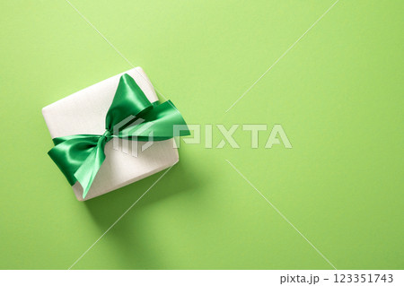 St Patricks day and March 17 gift on green background. View from above. Copy space St Patricks day and March 17 gift on green background. View from above. Copy space 123351743