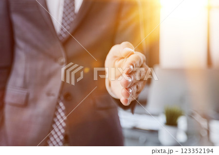Businessman manager stretching out hand for handshake to partner in office closeup. Team work concept 123352194