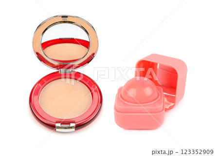 Powder compact and lip balm isolated on white background. 123352909