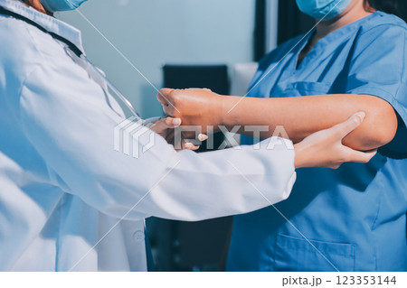 Orthopedist examining patient in hospital 123353144