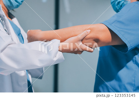 Orthopedist examining patient in hospital 123353145
