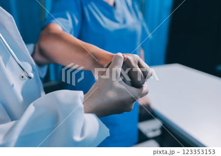 Orthopedist examining patient in hospital 123353153