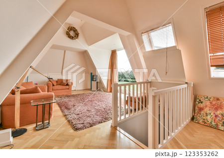 A stylish interior showcasing a modern living space with unique architectural features, soft colors, and comfortable furnishings that invite relaxation. 123353262