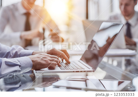 Closeup image of hands using and typing on laptop 123353333
