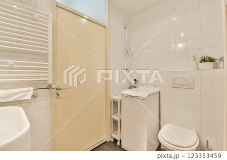A sleek and minimalistic bathroom showcasing contemporary fixtures and a clean aesthetic, perfect for any modern home. A sleek and minimalistic bathroom showcasing contemporary fixtures and a clean aesthetic, perfect for any modern home. 123353459