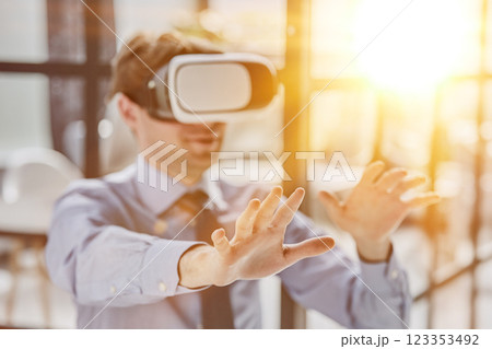businessman in virtual reality headset in the office 123353492