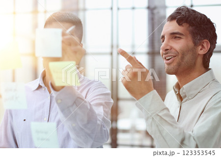two successful businessmen in the office discuss a plan on stickers 123353545