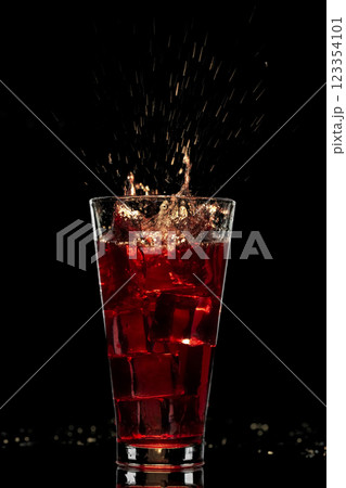 Red cocktail with ice 123354101