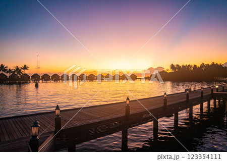 Sunset views from overwater pool villa in Maldives 123354111
